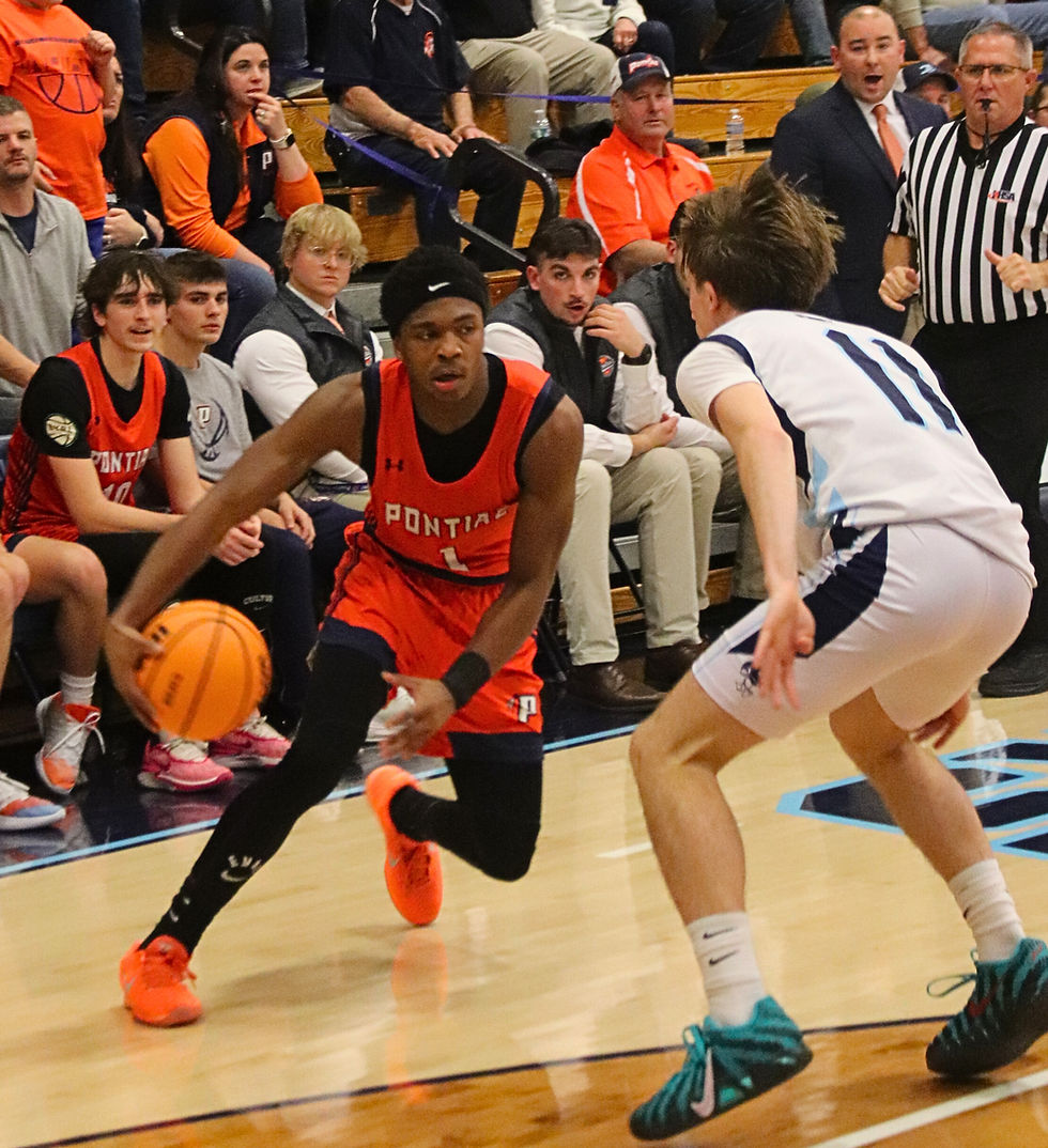 Pontiac’s Amazin King tries to make a move against Prairie Central defender DaneWheeler. King scored 12 points in the Indians’ 63-42 win over the host Hawks on Dec. 19. (Erich Murphy/Bingo Magic Sports)