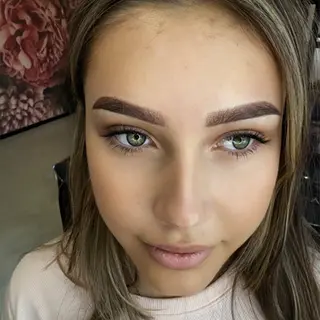 Young woman with blue eyes, defined eyebrows -manuela-johannesburg