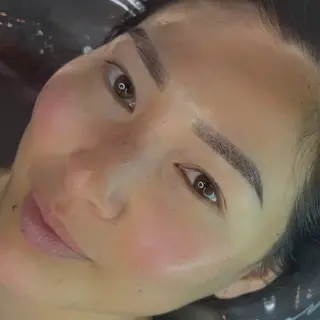 Close-up of a woman's face with perfectly microbladed eyebrows--manuela-johannesburg