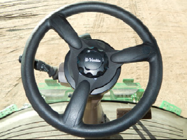 Trimble EZ-Pilot Pro steering wheel in a tractor cabin