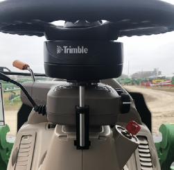 Thumbnail: Trimble EZ-Pilot Pro steering motor installed on tractor cab steering column.