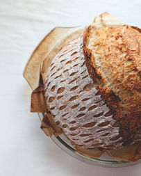 Sourdough bread with decorative scoring, baked until golden and crusty