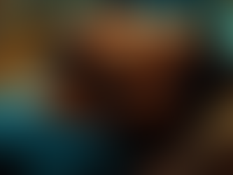 Man lying comfortably with eyes closed during a hypnosis session, surrounded by soft glowing patterns and warm light, representing a calm, focused trance state.