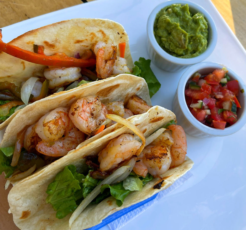 Shrimp tacos with side of guac and salsa