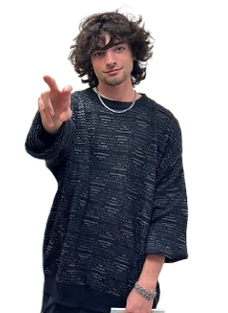 Justin standing and showing a peace sign.