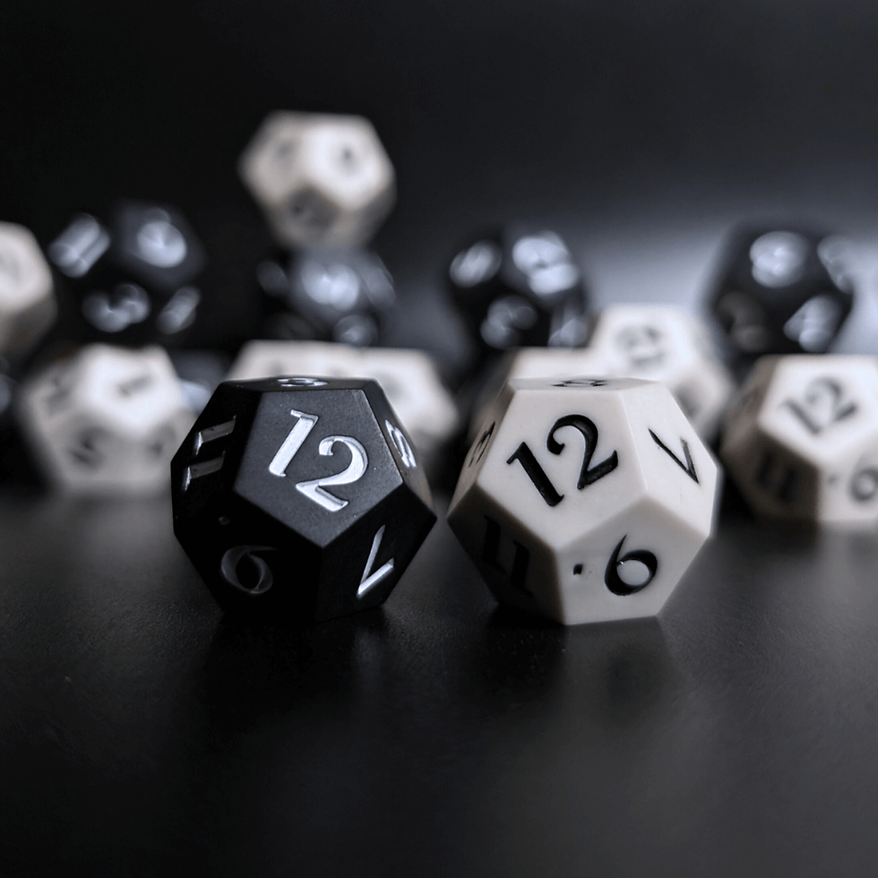 Two D12 Dice, duality hope & fear dice for daggerheart, sit in the foreground. Blurred dice are in the background.