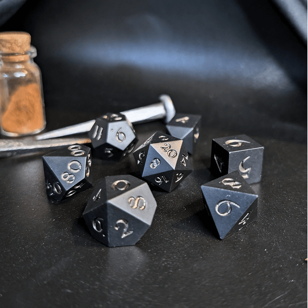 Black dice set with deep metallic gold numbers made with Jesmonite, on a dark background