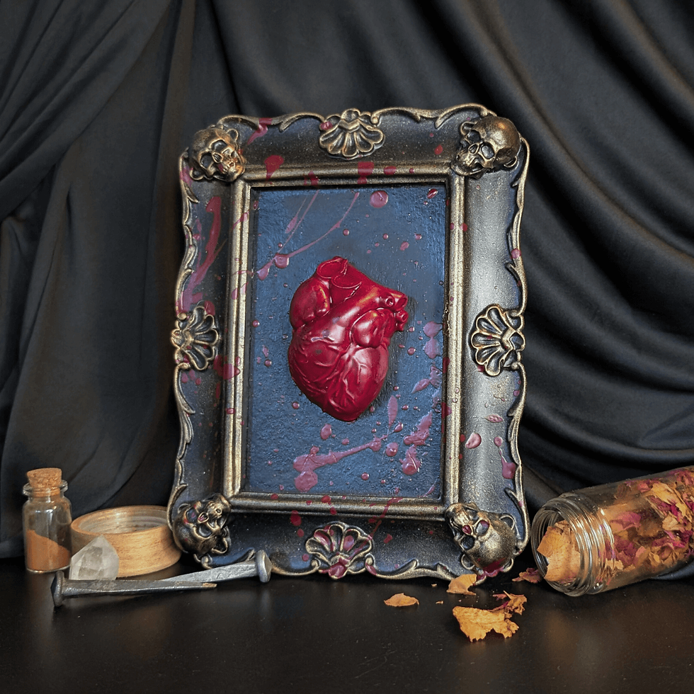 Heart art in antique frame. Bloodied Gold Jesmonite Handmade Dice Set - Ready. Dark background and decorative frame.
