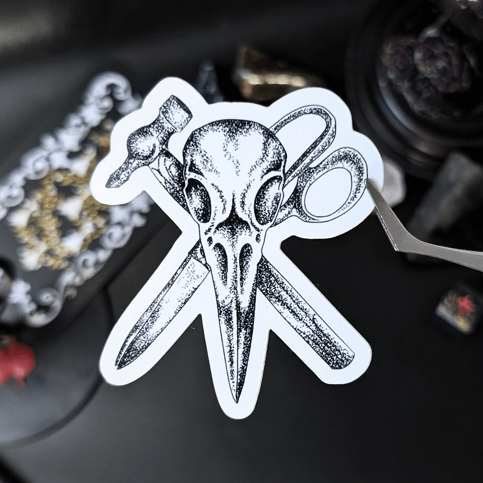 Thumbnail: Bird skull with hammer, scissors tattoo sticker on black background. Roll Gothica