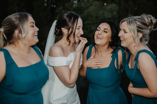 Bride and her bridesmaids lakeside at cardiff venue canada lodge