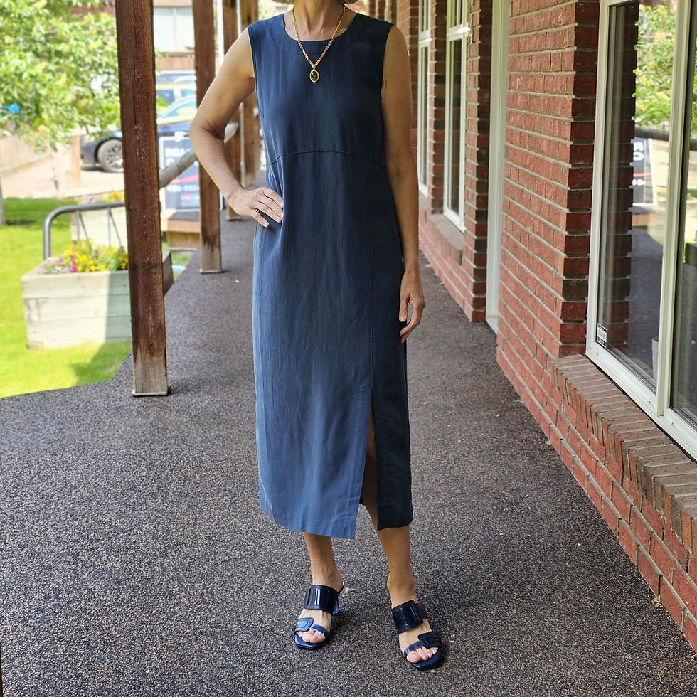 A midi-length dress is both chic and breathable. A simple blue dress with a clean-cut design pairs perfectly with strappy sandals.