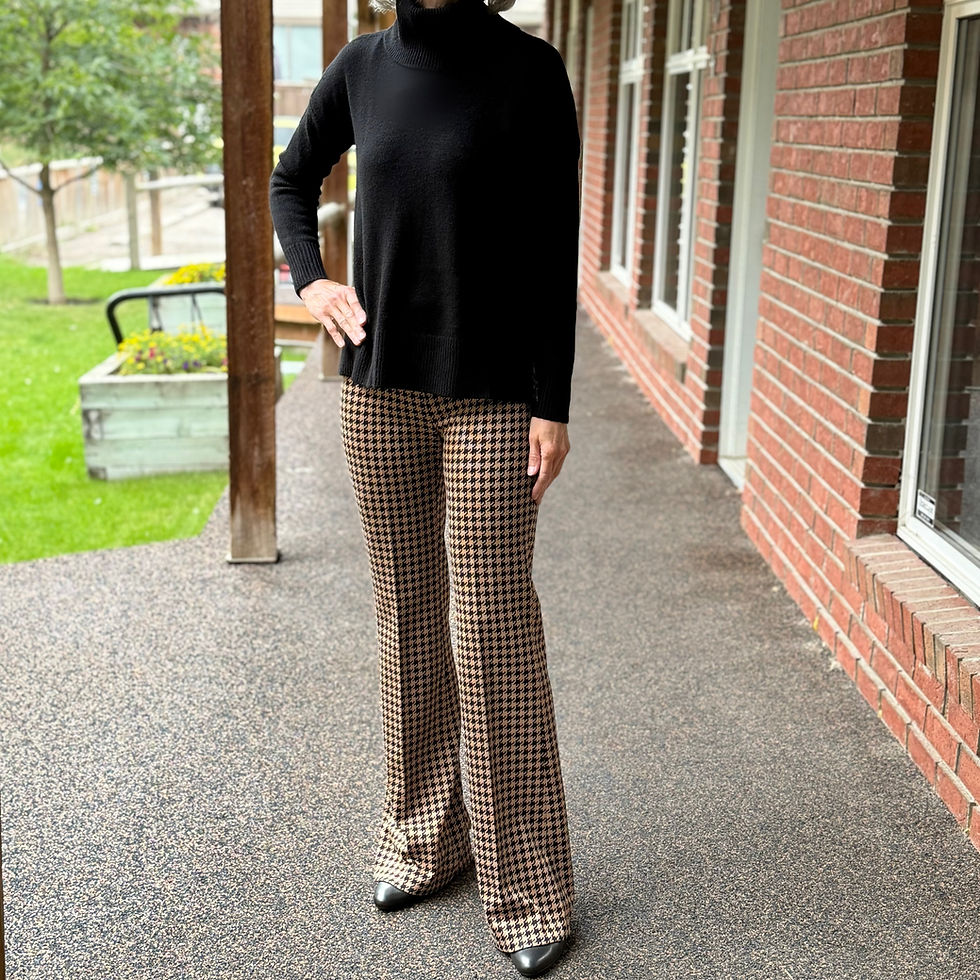 A knitted sweater with a houndstooth print in autumnal colours is a fresh update.