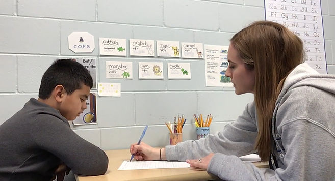 Teacher helping a student