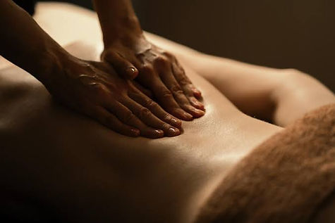 Hands massaging a back