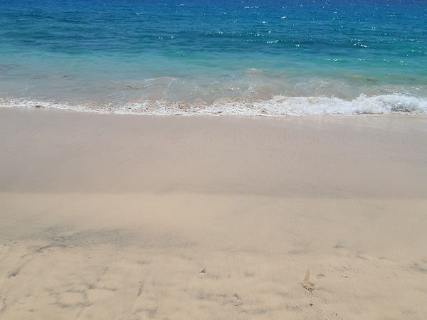 Weedon & Co, Wide shot of fine white sand beach in Sal, Cape Verde with Atlantic waves.