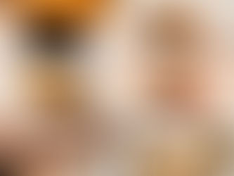 A sophisticated top-down view of a high-end Omakase preparation at Sushi Yorokobu BKK. The image features a succulent piece of Anago glazed with a dark, 6-year aged sauce, alongside a bright tray of premium Sea Urchin (Uni), steamed Abalone, and fresh Shima-aji fillets. The professional lighting accentuates the textures of the fresh seafood against the dark, elegant wood of the Edomae sushi counter.