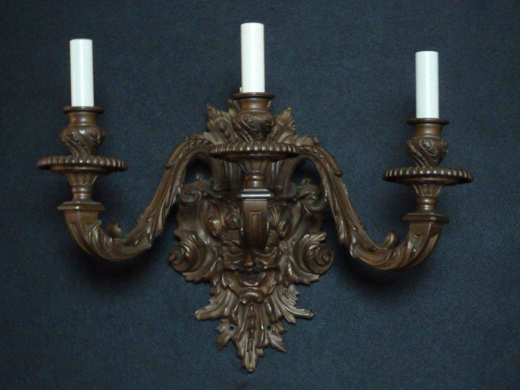 Pair of three-light patinated bronze wall fixtures