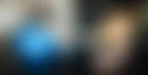 woman laying on her back with legs on yoga ball