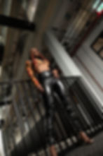 Crae Wolf wearing black leather trousers and flame top for press shots for Dangerous