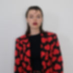 Tiktoker Ellie Dixon in a heart suit for her release Sucker