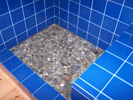 Shower cobalt blue glass tile pebble floor