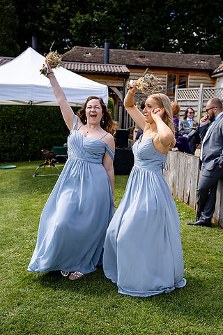 Bridesmaids laughing and having fun during the wedding celebration at Brookfield Barn, enjoying the special moments together