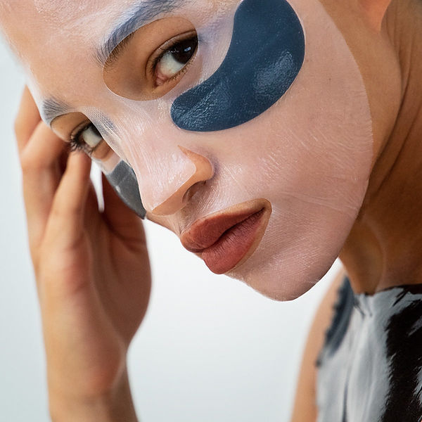 Young female with cosmetic mask
