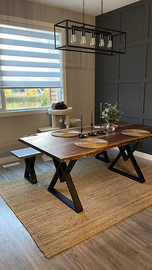 Wooden table with crockeries set on it inside a home