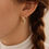 Thumbnail: Elegant Gold Knot Twist Infinity Earrings