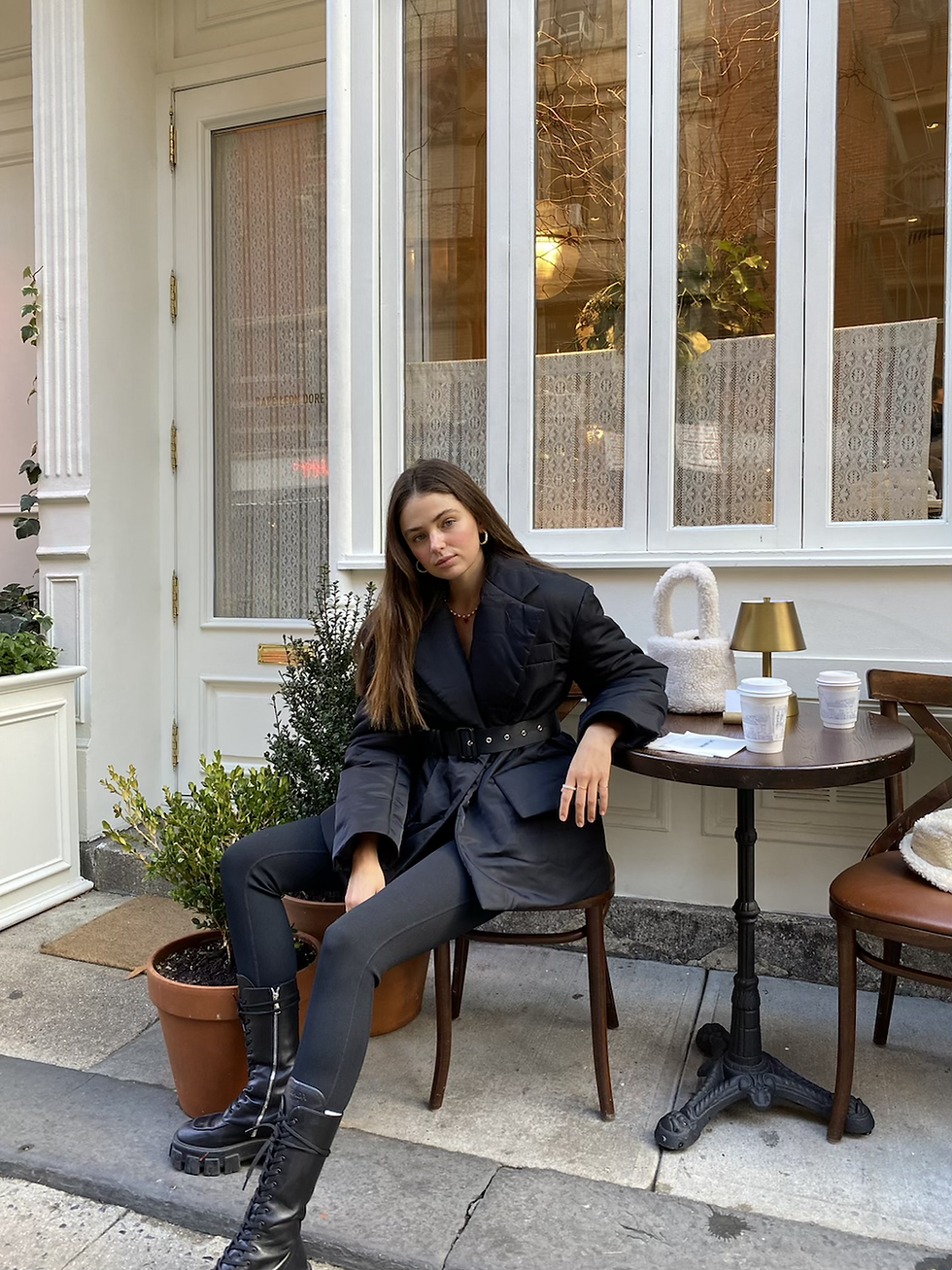 Thumbnail: Black Puffer Coat with a belt on a model
