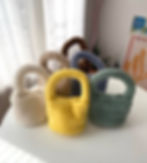 Eco Shearling mini bags on a table in White, Beige, Brown, Yellow, Blue and Green