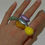 Thumbnail: Shiny acrylic rings on fingers