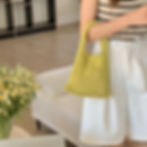 A yellow net handle bag