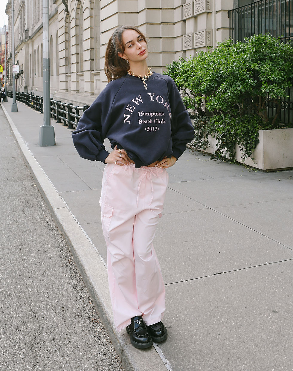 Thumbnail: Fashion model styling the navy blue Hamptons Beach Club graphic sweatshirt