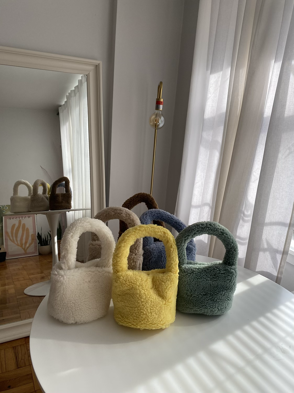 Thumbnail: Eco Shearling mini bags on a table in White, Beige, Brown, Yellow, Blue and Green