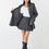 Thumbnail: A dark grey shirt jacket and a mini skirt on a model