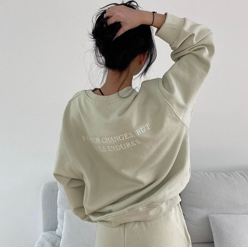'Fashion Changes But Style Endures' mint sweatshirts on a model