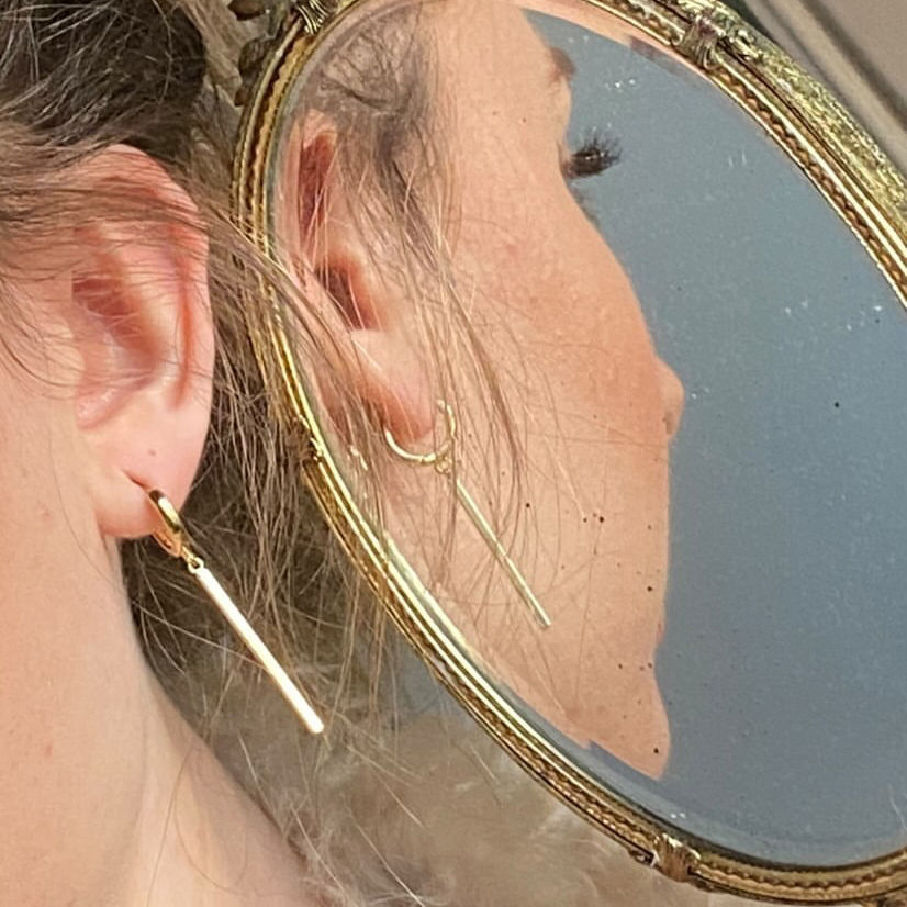 Thumbnail: Gold Bar earring on a model's ear