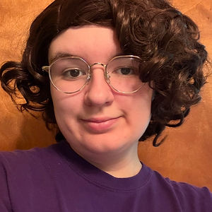 Mae has been a diehard Rocky Horror fan for five years and overall weirdo for much, much longer. Although she’s new to shadowcasting, she has been involved in the arts her whole life and is currently pursuing a degree in Theatre at UB. You can typically find her hanging out with her boyfriend or yelling Jeopardy! answers at the TV. She loves costumes, cooking, and her dog Piper. You can follow her on Instagram @maybe.mae.b.naught