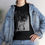 Thumbnail: Woman wearing a graphic t-shirt with image of a black cat with the words "Straight Outta catnip"