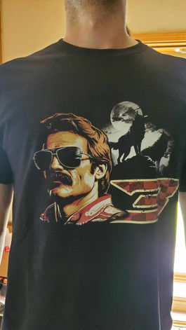 Image of a professional stock car driver with two wolves howling in the background.