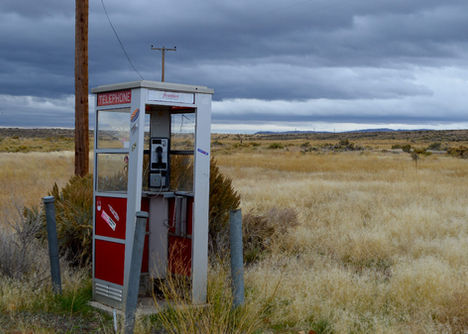 Pay phone booth in the middle of nowhere