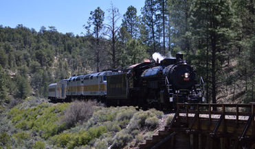 Grand Canyon Railroad's steam engine no. 4960 approaching a trestle