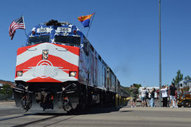 Grand Canyon Railroad engine #365, with their 125th anniversary paint on the front, leaving the station in Williams, AZ
