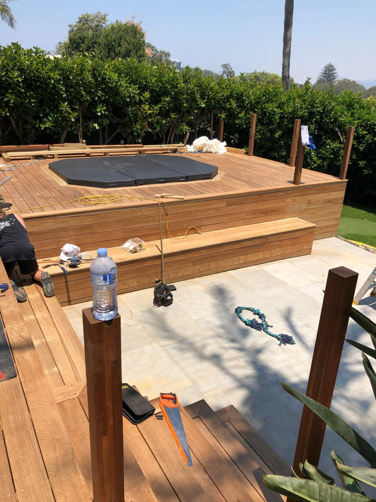 Twelve-person spa being integrated into a timber deck in Warriewood