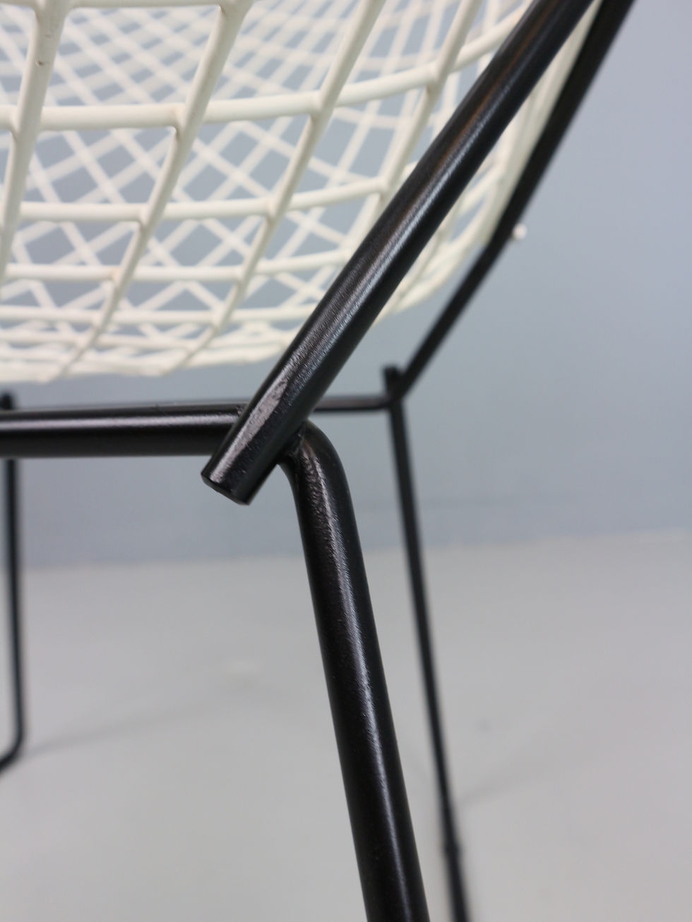 Thumbnail: Set of two Diamond chair by Harry Bertoia in white & black metal. 1960s