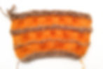 In this swatch I experimented with different yarns, decrease placements, and the number of garter ridges.