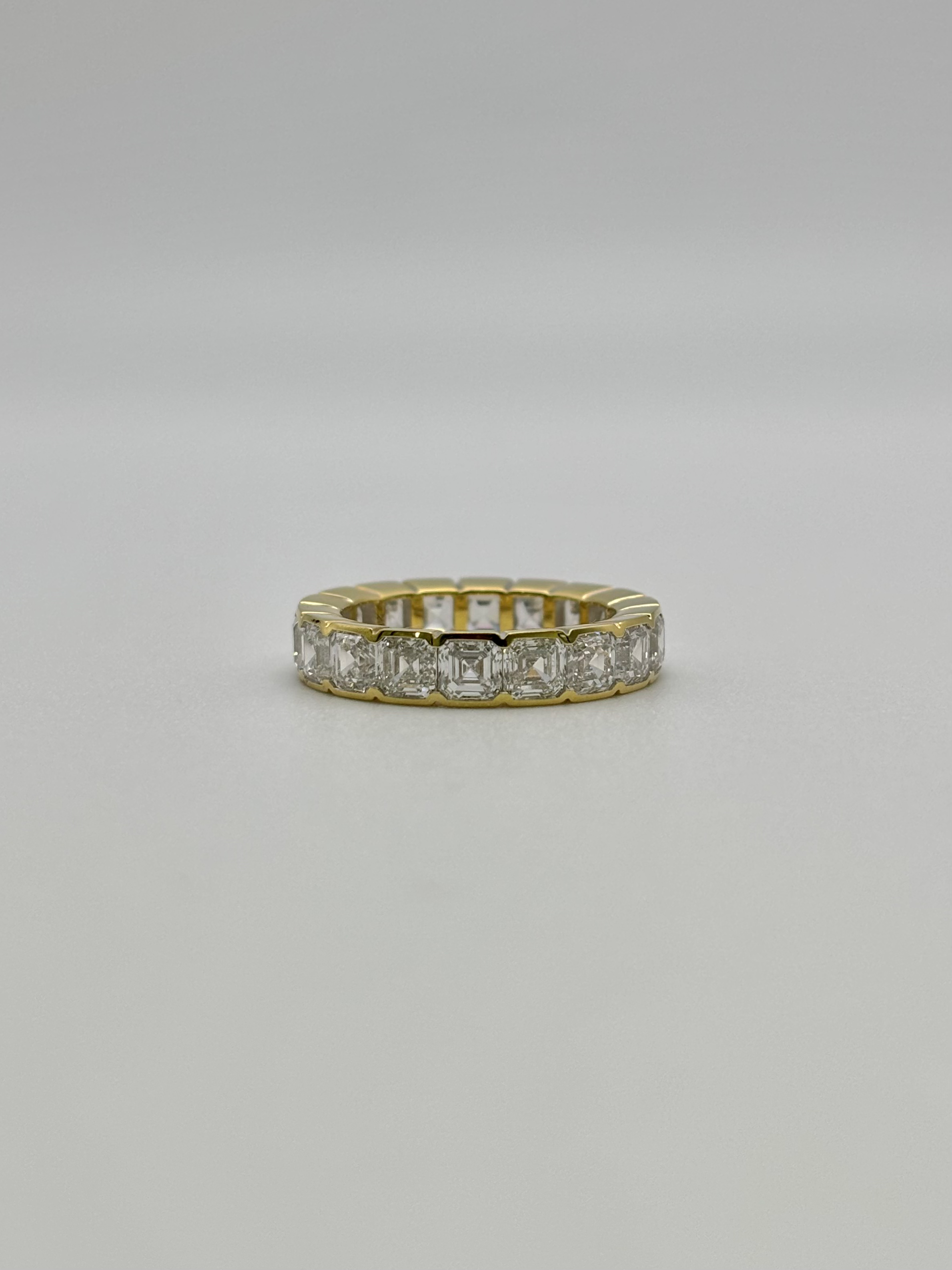 18k yellow gold Asscher cut diamond eternity band, bezel setting, fine luxury jewelry