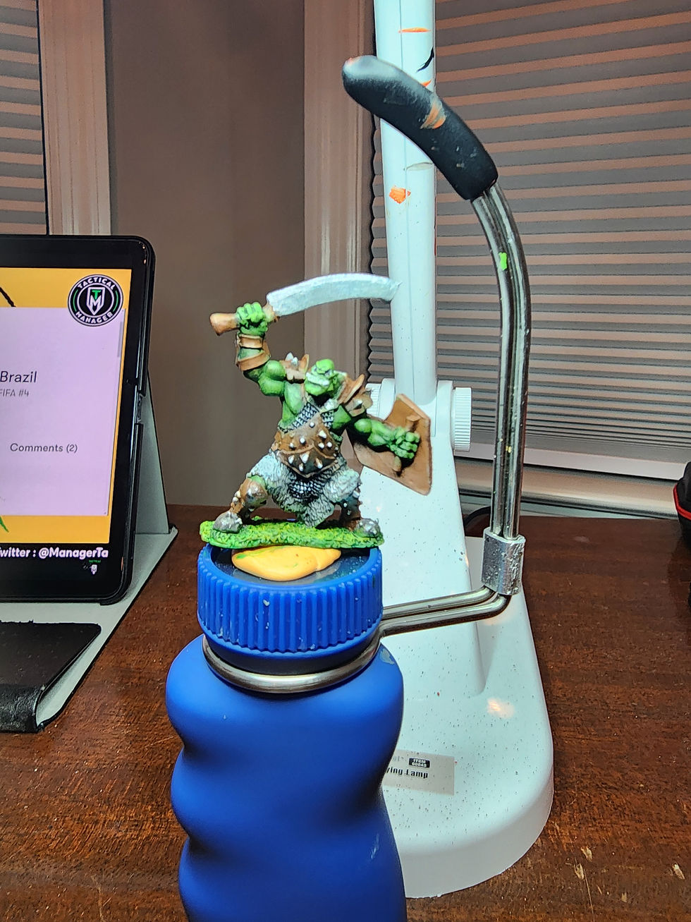 dry brushing, teeth, eyes and other details added to reaper bones orc miniature