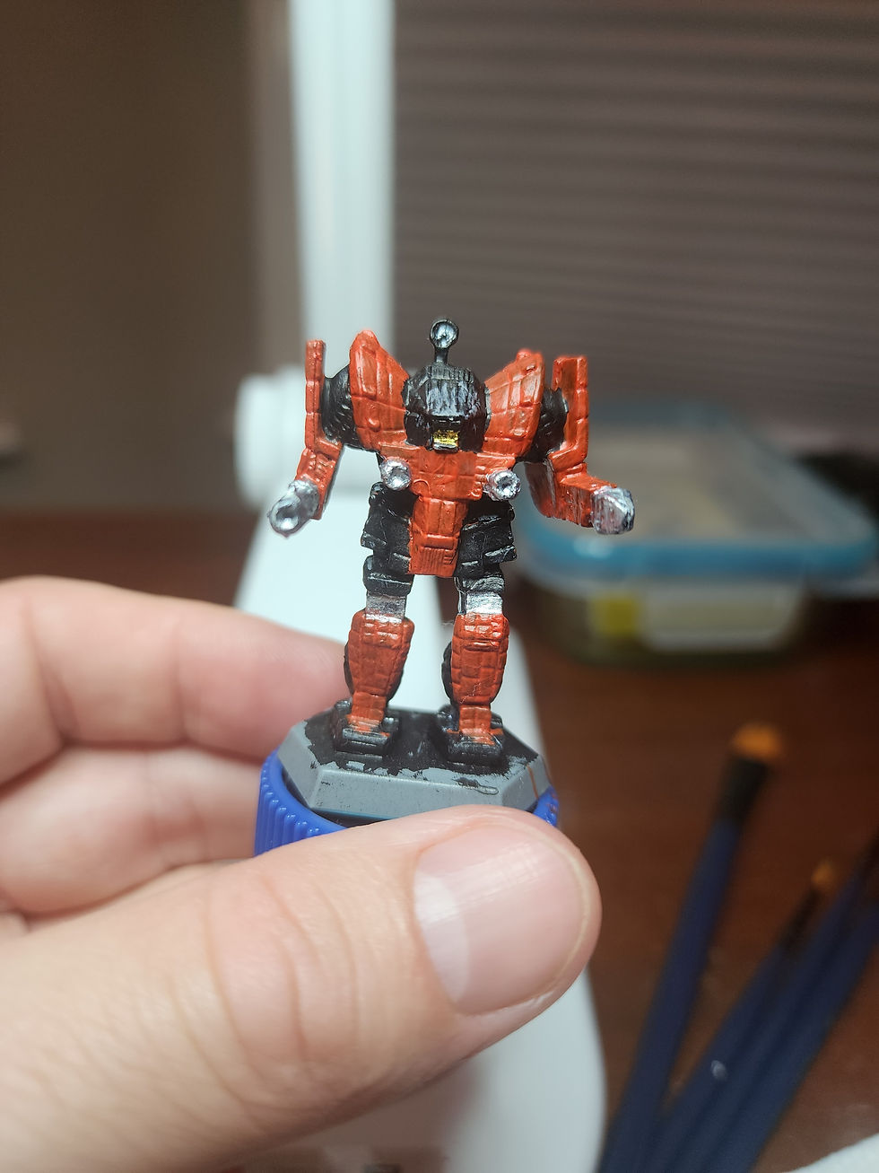 orange and black awesome battletech miniature